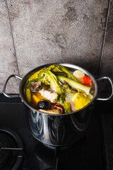 cooking broth on chicken and vegetables