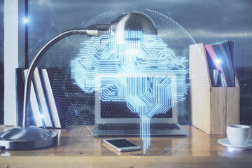 Multi exposure of work table with computer and brain hologram. Brainstorm concept.