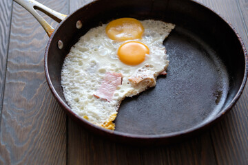 Fried egg with fried egg on a cooking pan