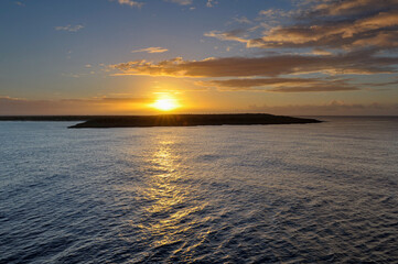 Beautiful sunset on the Pacific Ocean seen from cruise ship close to Isle of Pines, New Caledonia
