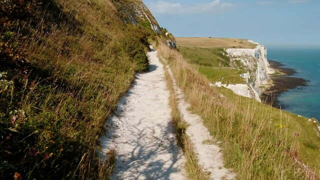 Walking along the White Cliffs of Dover, Kent, England, UK, a designated Area of Outstanding Natural Beauty