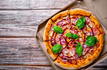 Pizza with chicken and barbeque sauce . Italian pizza on wooden table background