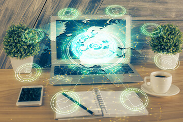 Computer on desktop with social network theme icon. Multi exposure. Concept of international...