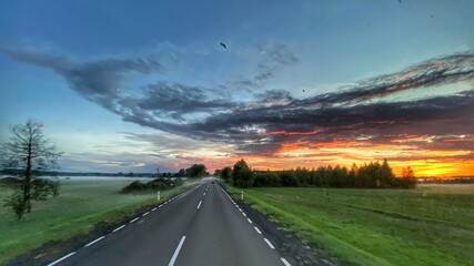 Road in Poland. Sunset. Goldenhour. Beautiful sky.  © Mateusz