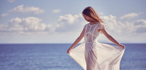 Portrait of a girl in a dress in nature