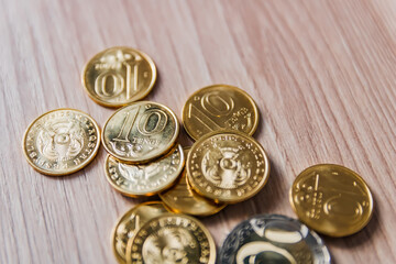 coins scattered on a wooden table