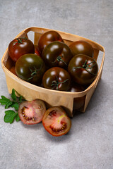 Fresh ripe sweet reddish brown and green kumato tomatoes