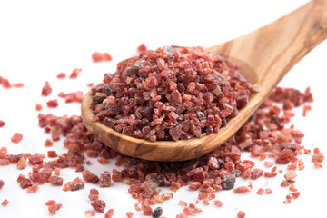Black himalayan salt in a wooden spoon 