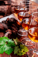 Tasting of aged french cognac brandy in old cellars of cognac-producing regions Champagne or Bois, France