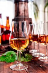 Tasting of aged french cognac brandy in old cellars of cognac-producing regions Champagne or Bois, France
