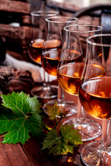 Tasting of aged french cognac brandy in old cellars of cognac-producing regions Champagne or Bois, France