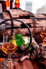 Tasting of aged french cognac brandy in old cellars of cognac-producing regions Champagne or Bois, France