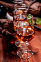 Tasting of aged french cognac brandy in old cellars of cognac-producing regions Champagne or Bois, France