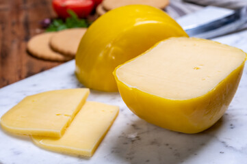 Dutch baby gouda cheese in yellow wax