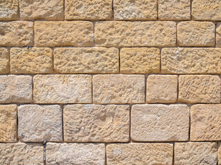 Real antique arab brickwall in sunny day background texture