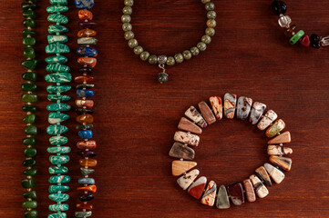 flat lay with natural stone bracelets and strings of beads