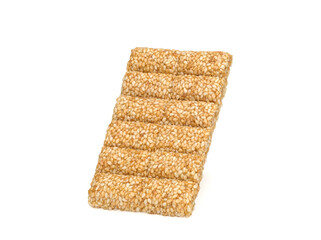 pressed sweet sesame bar on a white background. Sesame Kozinaki