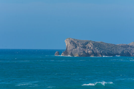 Cliff view with sky and blue sea, a summer afternoon, in Liencres, Cantabria, Spain, horizontal