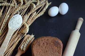 Fresh rye bread with ingredients for cooking, top view