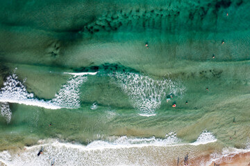 Fototapeta premium Thassos seaside beach with turquoise water and big waves aerial view.