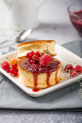 Close up Fluffy Soufflé Japanese pancake recipe with berry. Trendy asian food for breakfast.