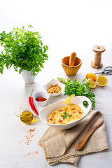 hummus paste with lemon and chilli on white background