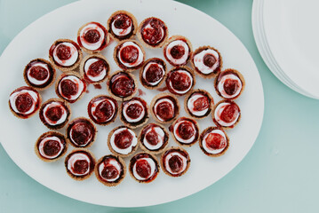 strawberry baked pastry with jam on a plate