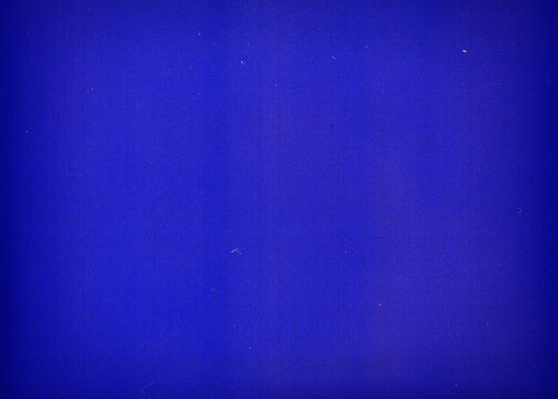 Noisy blue film frame with scratches, dust and grain