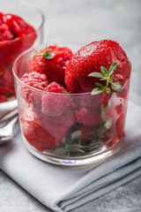 Summer raspberry sorbet with fresh raspberries, selective focus image