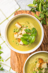 Plate of summer delicious pea  soup with green peas. Top view
