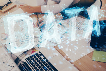 Double exposure of woman's writing hand on background with data technology hud. Big data concept.