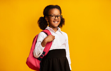 Lovely Black Schoolgirl With Backpack Posing, Studio Shot