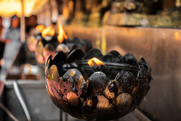 Lighting candles in the temple