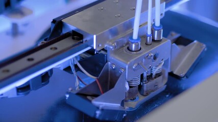 Three dimensional printing machine printing 3D plastic model at modern technology exhibition, factory. 4.0 industrial revolution, manufacturing, 3D printing and robotic automation technology concept