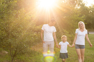 Fototapeta premium happy young family spending time outdoor on a summer day