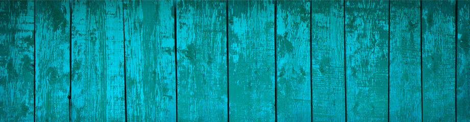 Blue texture of old painted wood. Turquoise wooden background. Banner with texture of vintage shabby planks.