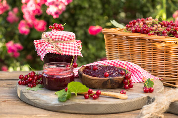 Fototapeta na wymiar Homemade redcurrant jam. Fresh berries of currants. Concept cooking confiture