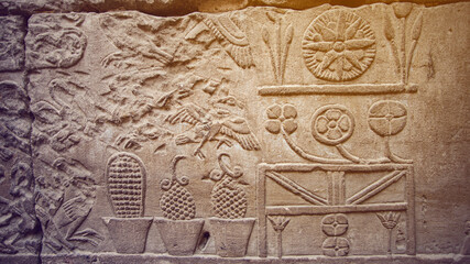 Hieroglyphic in Edfu HOrus temple showing abundance of food resources corn grape culture of Egypt meal kitchen pots and jars - obrazy, fototapety, plakaty
