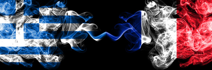 Greece vs France, French smoky mystic flags placed side by side. Thick colored silky abstract smoke flags.