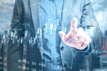 Fototapeta na wymiar Businessman using stock chart interface