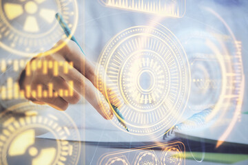 Fototapeta premium Tech theme hologram over woman's hands taking notes background. Concept of hightech. Double exposure