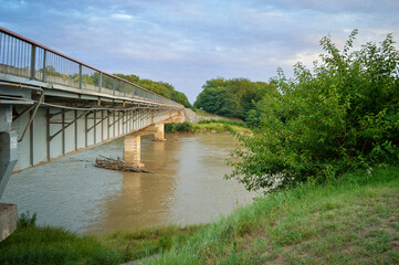Bridge with concrete pillars across the river