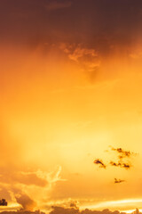 Sunset / sunrise with dramatic cloudscape, vivd colors and negative space for copy
