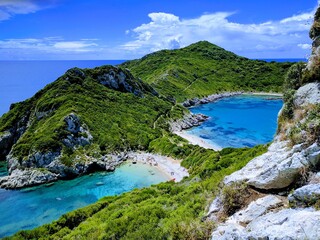 Obraz premium Afionas beach (Porto Timoni) as seen from a higher angle with crystal clear azure water and empty beaches in Corfu (Corfu, Greece, Europe)