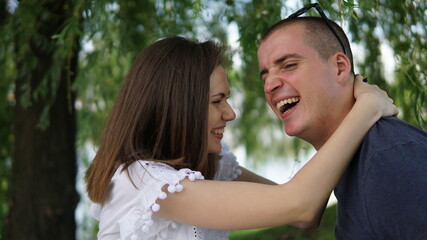 Obraz premium Young couple, portrait of man and woman in park