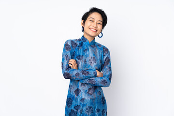Young Vietnamese woman with short hair wearing a traditional dress over isolated white background...