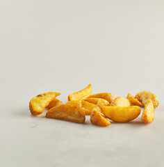 Potato wedges shot on white background