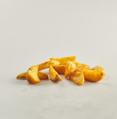 Potato wedges shot on white background