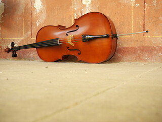 Cello on the white stone floor. Copy space © Life pics