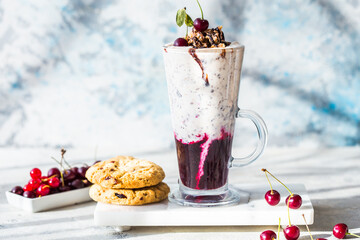 Sweet cold Ice cream sundae with chocolate, vanilla and cherry. Freakshake